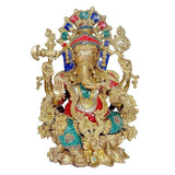 Brass Ganesha statue, seated front view, detailed jewelry, jeweled blue-red headpiece