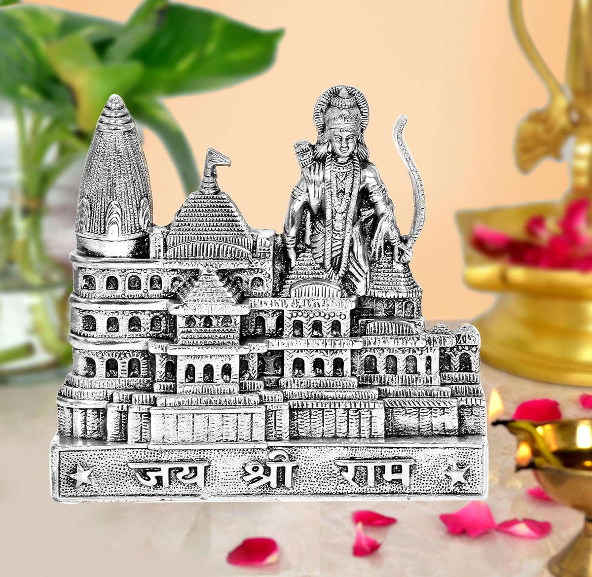 Silver metal Ram Mandir architectural model with standing deity figure on detailed temple base