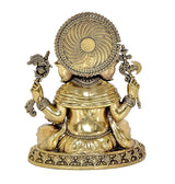 Brass Ganesha idol back view, circular halo design, seated form with ornate jewelry