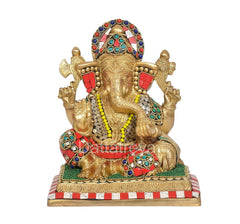 Brass Ganesha idol, arched arms and jeweled headpiece, colorful base, full front view