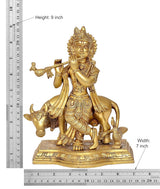 9-inch brass Krishna figurine with cow and flute, shown with measurement markings