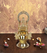 Brass Goddess Mariamma diya with raised arch frame and central idol