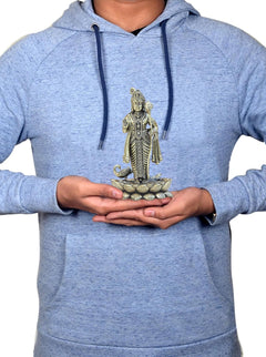 Lord Kartikeya Murugan brass showpiece held with both hands by person in light blue hoodie