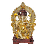Brass Ganpati Bappa seated idol with gold filigree backdrop and red halo on base