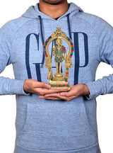 Brass Lord Kartikeya Murugan idol held in hands on decorated base