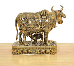 Kamdhenu cow deity murti with calf, full side view on ornate round bronze base