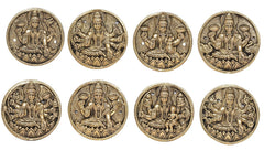 Eight brass Ashtalakshmi relief plaques, front view oval coins with ornate detailing