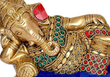 Close-up of brass Ganesha face and torso with red, green, and blue beadwork