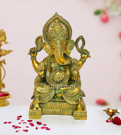 Brass Ganesha statue, multi-color finish; seated with four arms and detailed crown