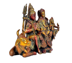 Brass Shiva family statue on Nandi with trident, seated devotees and small figures