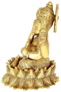 Brass Ganesha idol statue holding a trident, seated on patterned base, 6-inch