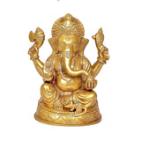 Brass Ganesha idol, four arms raised, seated on round base, blessing pose