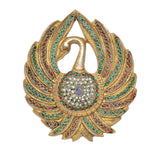 Brass peacock wall hanging close-up: jeweled fan edges and bell-shaped center