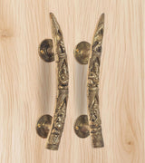 Ganesha brass door handles with two lever handles and circular round backplates, golden finish