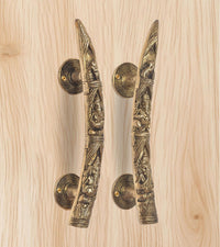 Ganesha brass door handles with two lever handles and circular round backplates, golden finish