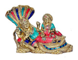 Brass Vishnu and Lakshmi sitting together on Shesh nag, painted turquoise and red