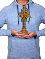 Brass Garuda idol statue held in hands on chest, green-gold figure