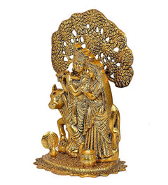 Goldenes Radha-Krishna-Metallidol seitlich: zwei Figuren mit Kuh und Baumrückwand