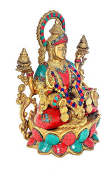Brass Dhan Lakshmi idol three-quarter view, detailed ornaments, jeweled blue-red sari