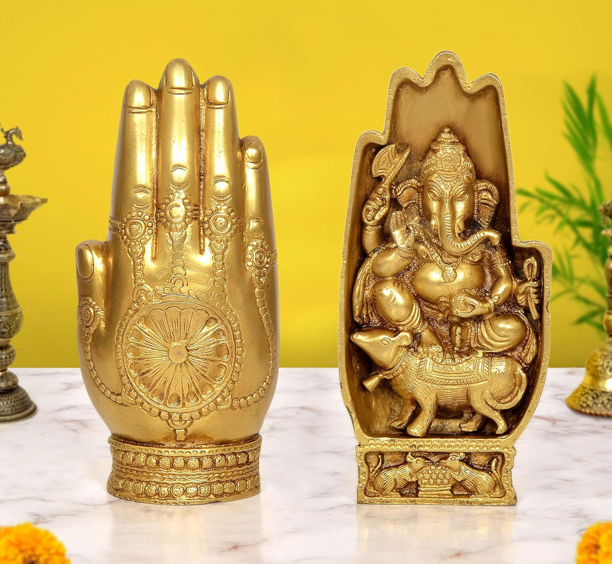Brass Ganesha idol with blessing hand, seated on a mouse base—front and back view.