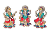 Lakshmi Ganesha Saraswati trio statue, silver finish, front view with crowns and raised hands