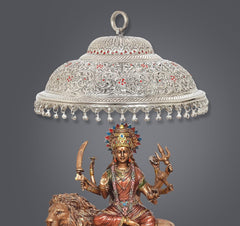 Silver carved chatttar dome with red floral inlay, hanging beads, and ring handle