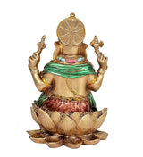 Back view of Ganesha resin statue, circular halo and green drape, seated on lotus