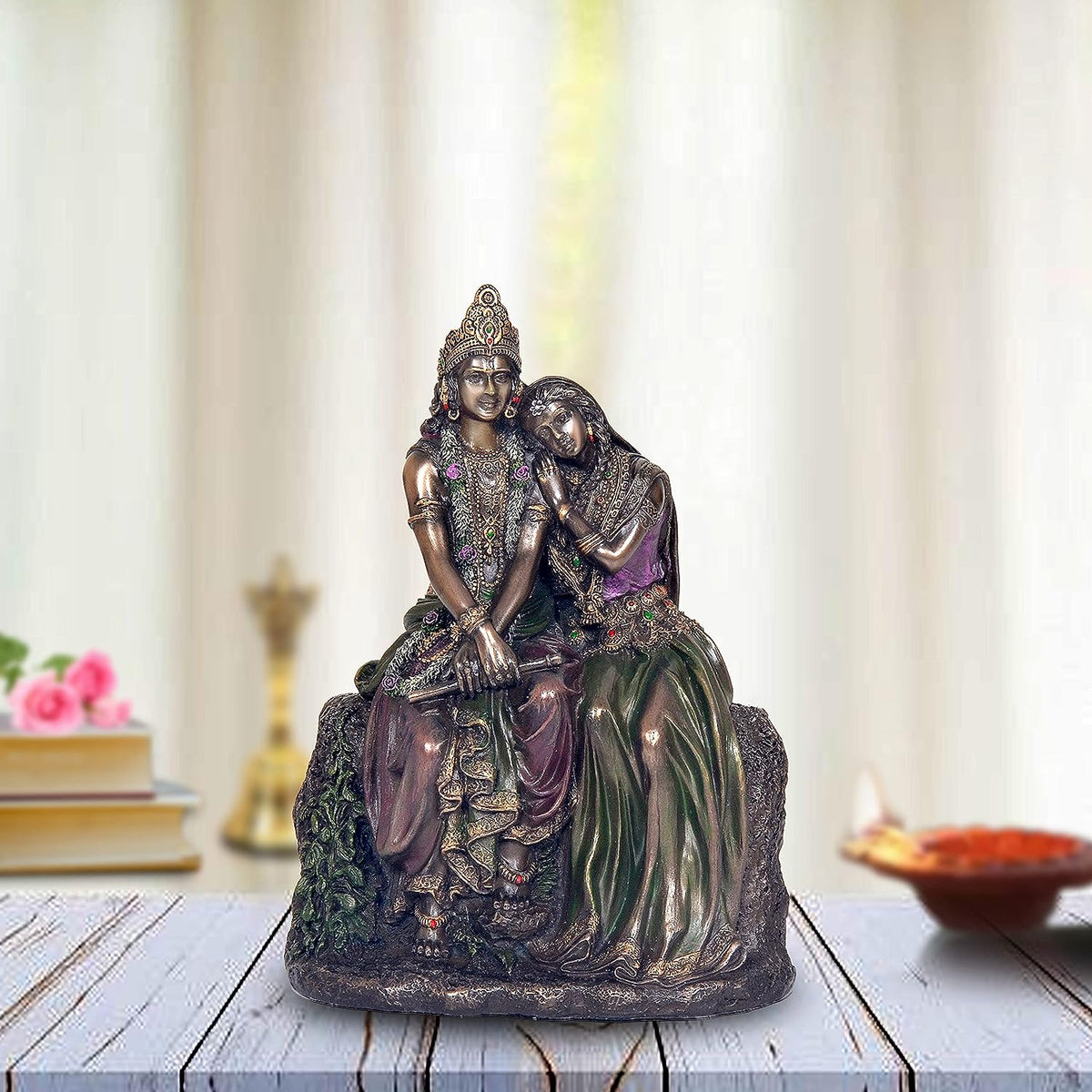 Resin Radha-Krishna seated statue, purple-green attire, ornate crowns