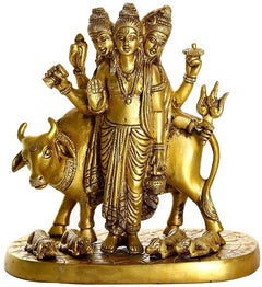 Brass Trimurti statue riding cow, raised hands and crown, detailed faces on base
