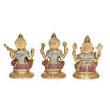 Brass Saraswati, Lakshmi & Ganesha idol statues, back views with patterned red and white