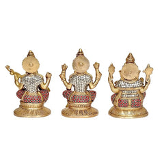 Brass Saraswati, Lakshmi & Ganesha idol statues, back views with patterned red and white
