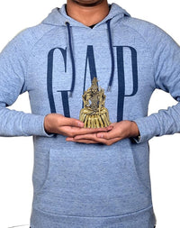 4-inch brass goddess idol held in hands, gold tone seated figure with crown and ornaments