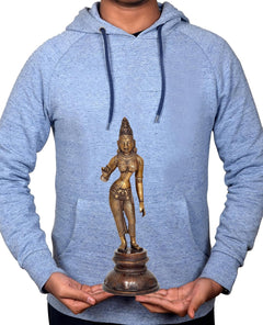 12-inch brass Parvati statue held in hands by person wearing a light blue hoodie