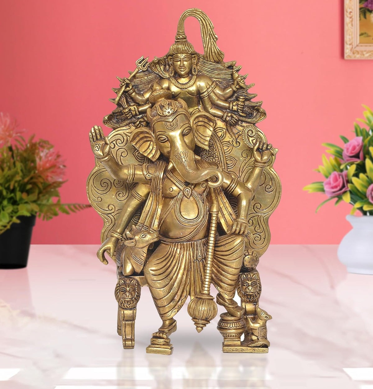 Golden brass Lord Ganesha statue, seated with detailed ornaments and raised hands