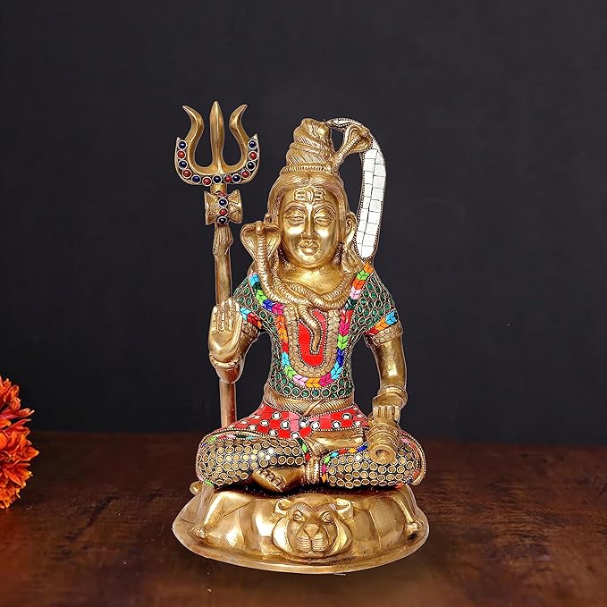 Brass Lord Shiva seated idol with trident, colorful ornaments, 13 in height.
