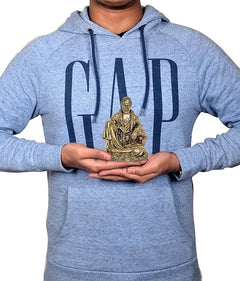 Brass Shirdi Sai Baba 4-inch statue held in hands for scale.