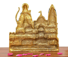 Back view of golden Ram Mandir metal model with sculpted deity and stone base
