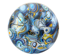 Steel tongue drum top view with blue peacock swirl design and metal tongues