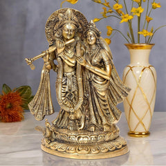 Brass Radha Krishna idol statue, seated pair holding flute, ornate crowns
