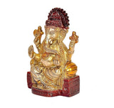 Brass Ganesha idol statue, side angle, four arms, red base