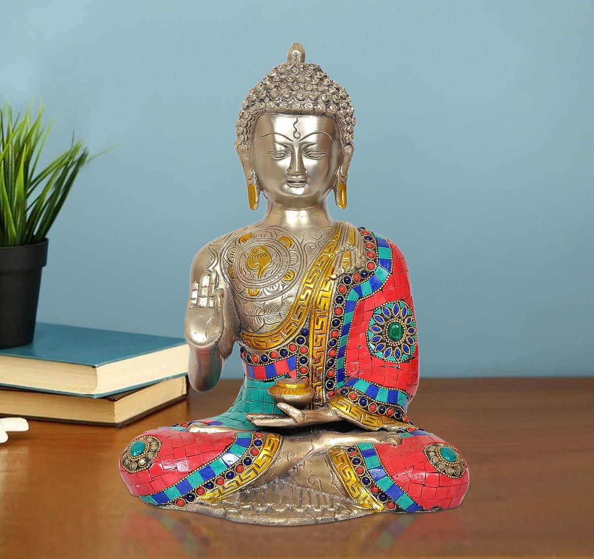 Brass meditating Buddha statue, colorful mosaic robe, seated with hands in lap
