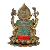 Back view of Ganesha brass statue on lotus, circular halo and colorful waist inlay