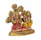 Lakshmi and Ganesha metal idol, close front angle, red and yellow details