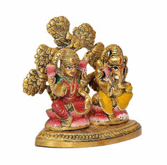 Lakshmi and Ganesha metal idol, close front angle, red and yellow details
