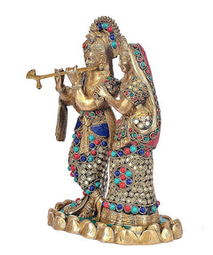 Brass Radha Krishna idol, Krishna with flute and Radha beside him on pedestal.