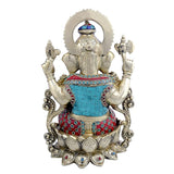 Back view of brass Ganesha statue, carved dhoti with blue center panel, four arms