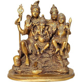 Brass Shiva Parivar showpiece with four seated figures and raised tridents, 12 inch.