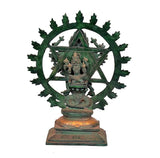 Ornate metal idol with halo disc and seated figure, detailed base platform view