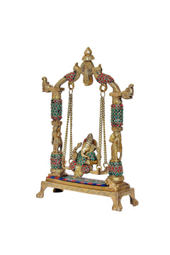 Brass Ganesha jhula side view, colorful patterned pillars and hanging chain frame