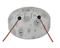 Steel happy drum with two wooden rubber mallets and soccer pattern on top